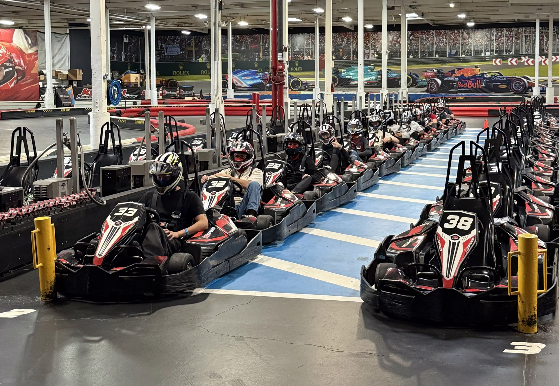 The team lined up in go-karts on an indoor track